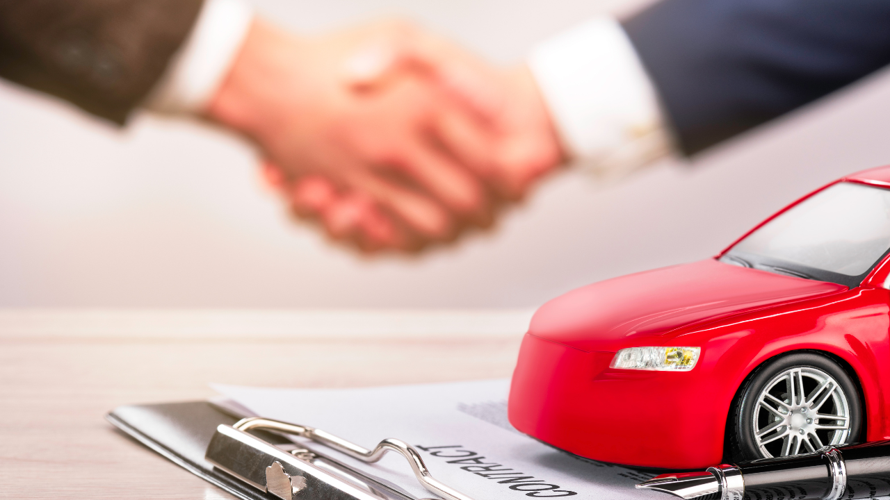car and contract with handshake